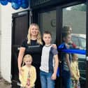 Kim with Reece and Myla, at the family hub opening