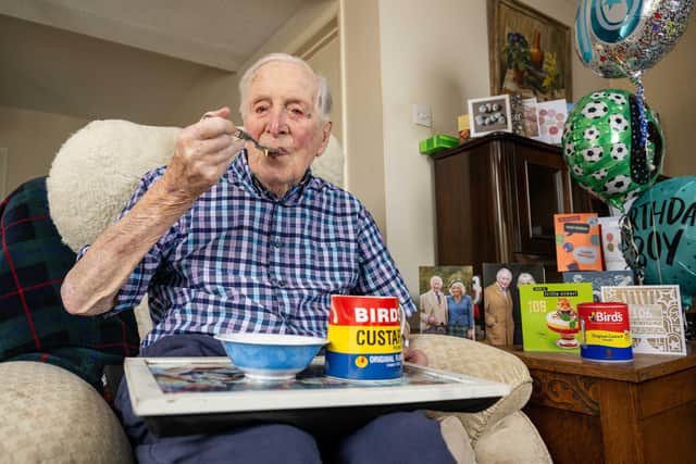106 year old Leslie Lemon with his Birds Custard, which he says is the secret to his long life. Photo: James Linsell Clark / SWNS