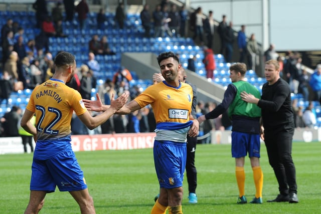 Mal Benning is congratulated on his winning goal by CJ Hamilton after the final whistle. It gave Mansfield a first win in ten matches as they attempted to get into the play-off places.