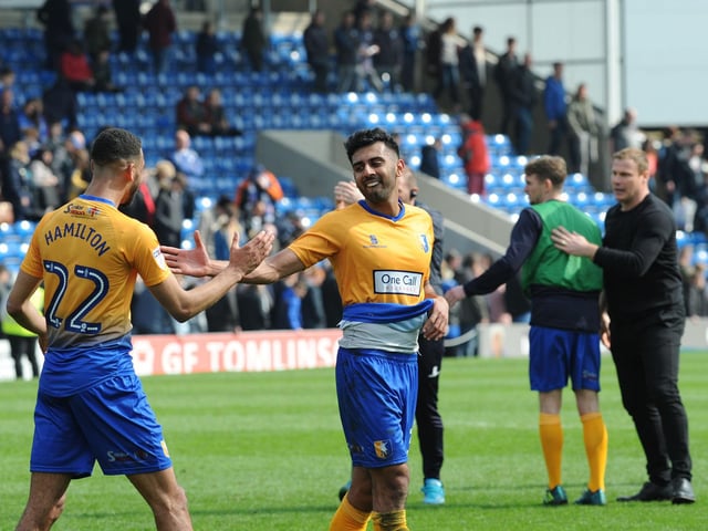 Mal Benning is congratulated on his winning goal by CJ Hamilton after the final whistle. It gave Mansfield a first win in ten matches as they attempted to get into the play-off places.