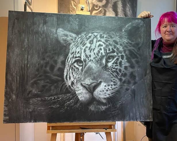 Becky with her fabulous animal art - this leopard took nearly two weeks to draw