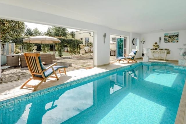 The indoor pool with doors on to the garden