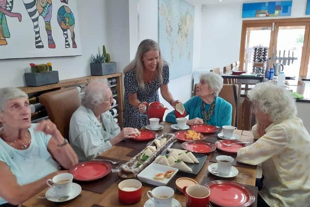 Older people enjoying a Re-engage tea party