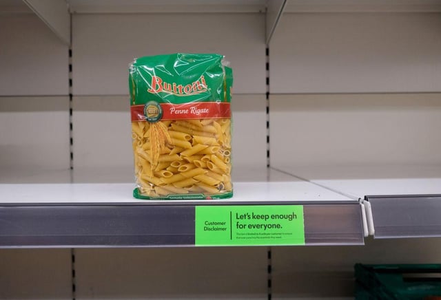 Almost-empty shelves where pasta would normally be stocked are pictured inside a supermarket store in north London (Photo: ISABEL INFANTES/AFP via Getty Images)