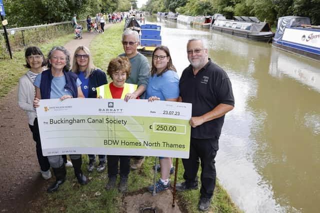 Buckingham Canal Society members receive the donation