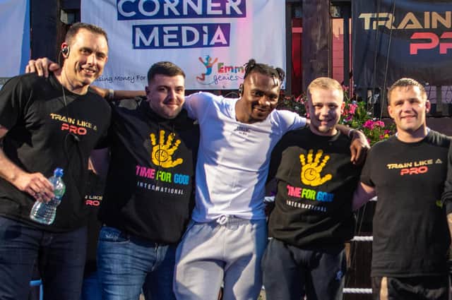 Linus Udofia (centre, in white) - pictured last year at a Pegasus charity event - was beaten in his British Middleweight title fight on a split decision