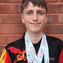 Cameron with his some of his medals