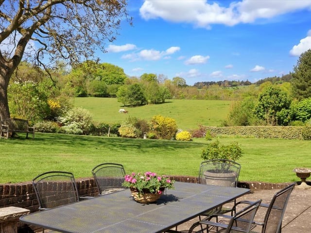 The gardens are beautifully landscaped with lawns and a large paved terrace with floral and shrub beds. There are numerous specimen trees with the whole garden enclosed by a combination of mature hedging and fences. There is also a kitchen garden.
