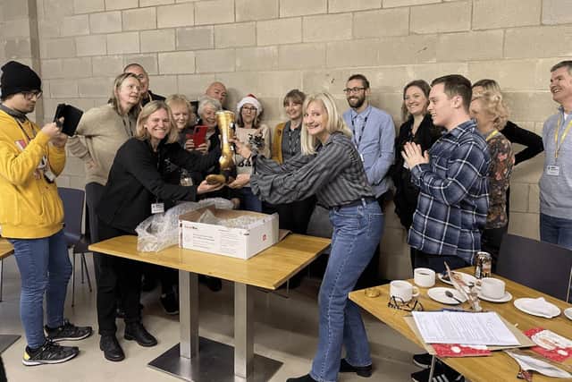 The NPHT team unwrapping Adam Hills MBE prosthetic foot, after it arrived at the Paralympic Heritage