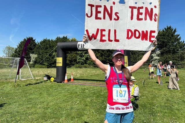Jenna Hughes celebrating at the end of the race and final leg of her Jen’s Tens challenge