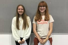 Lottie (L) and Maria (R) collect their results from The Buckingham School