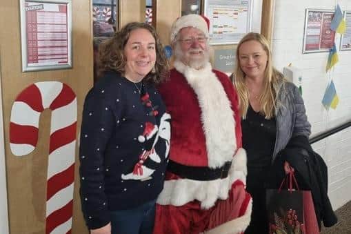 Heidi Young, left, with Santa and a Ukrainian guest