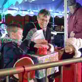 Competition winners Harry and Daisy turn on the Christmas lights with Mayor of Buckingham Margaret Gateley