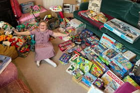 Eloise sorting and packing some of the generous toy donations