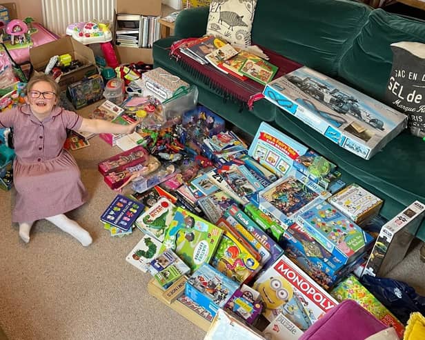 Eloise sorting and packing some of the generous toy donations