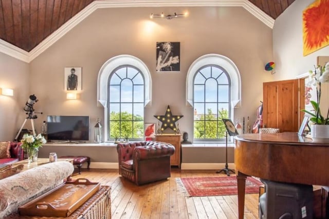 The amazing arched windows are among the home's character features