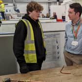 Councillor Joseph Baum speaking with one of the plumbing students from Buckinghamshire College Group