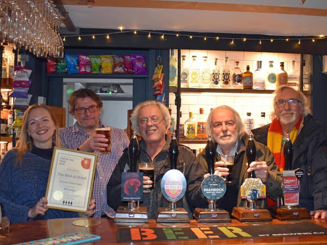 Pictured (left to right): Katie (pub general manager), Mike Clarke (CAMRA branch chair), Elvis Evans (branch deputy chair), Tony Gabriel and John Williamson (local CAMRA members)