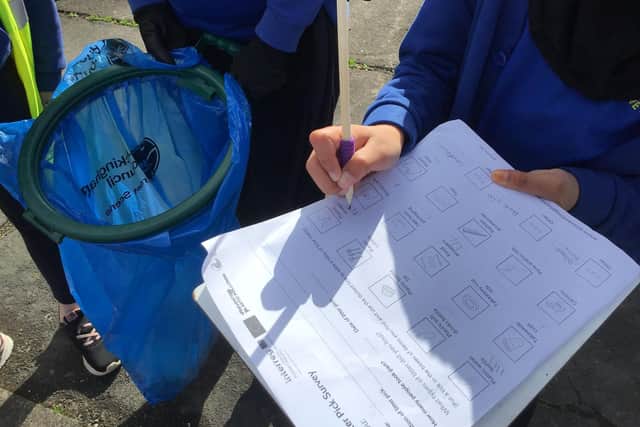 Completing the litter survey with bags in hand.