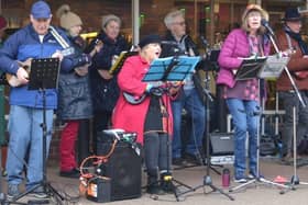 The Buckingham Ukulele Group playing outside Waitrose