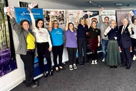Andrea Smith and Nick Hewer (centre) with representatives from all 12 chosen charities.