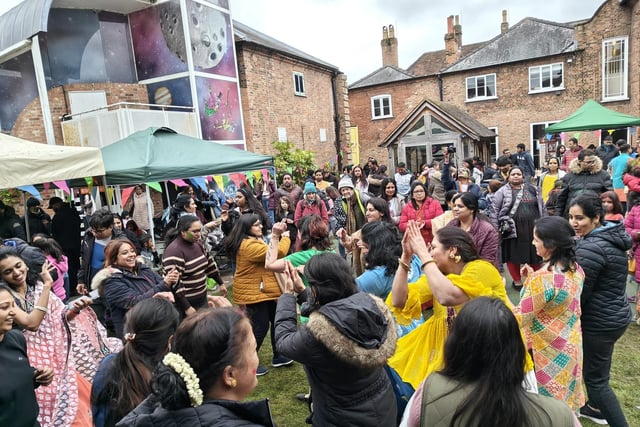 The crowd was encouraged to join in with the uplifting dancing to warm up.