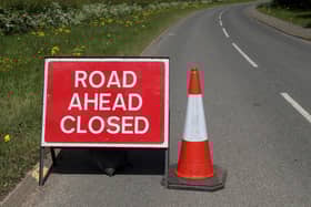 Road closed sign.