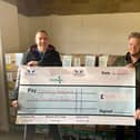 Andy Rudol of Pegasus Gym and Former Aylesbury Mayor Timothy Dixon with the cheque of £1000 for the Aylesbury food bank.