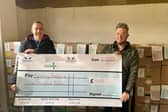 Andy Rudol of Pegasus Gym and Former Aylesbury Mayor Timothy Dixon with the cheque of £1000 for the Aylesbury food bank.