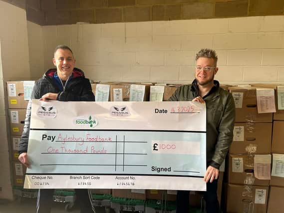 Andy Rudol of Pegasus Gym and Former Aylesbury Mayor Timothy Dixon with the cheque of £1000 for the Aylesbury food bank.