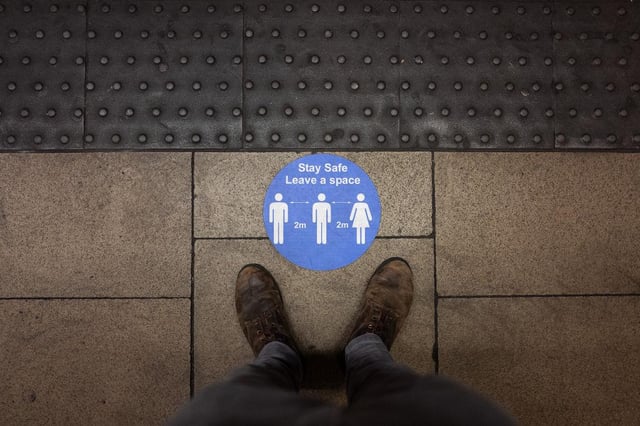 A social distancing sticker is seen on an underground station platform ahead of the evening rush hour in London (Photo: Leon Neal/Getty Images)