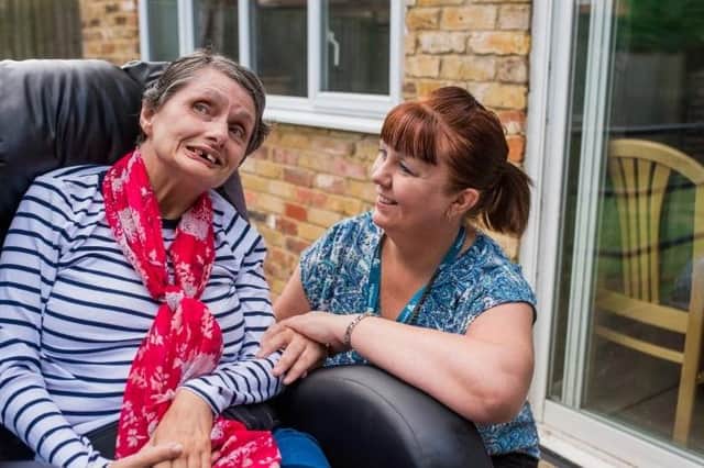 Manager of The Crossings Lesley Allister with one of the service users