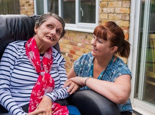 Manager of The Crossings Lesley Allister with one of the service users