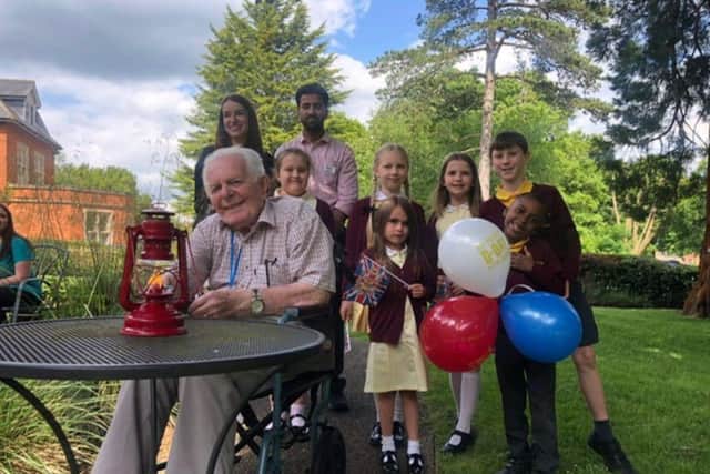 Iain Shann lit the Lamp Light of Peace for Maids Moreton Hall