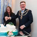 Care home manager Claire Watson and mayor Stephen Lambert join forces for the all important cake cutting.