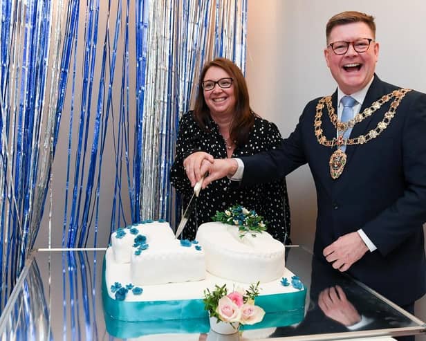 Care home manager Claire Watson and mayor Stephen Lambert join forces for the all important cake cutting.