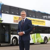 Darren Roe and an electric bus