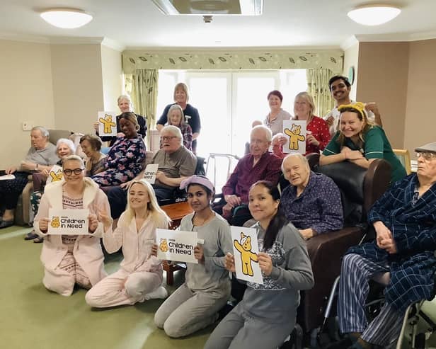 Residents and staff at Juniper House care home enjoy their pyjama day