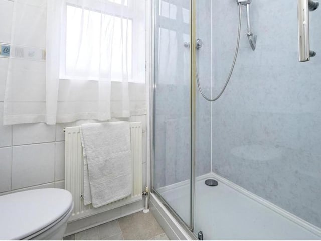This sizeable shower cubicle is the main feature of the shower room. Just step straight in!