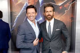 Hugh Jackman (L) and Ryan Reynolds (R) star in the film. (Photo by Monica Schipper/Getty Images for Netflix)