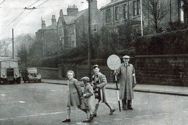 One of the very first school crossing patrollers in action in 1953