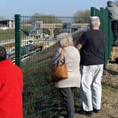Residents watch the NTC train at work