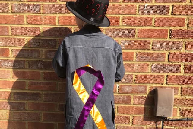 His costume featured the eczema awareness colours.