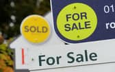 General view of Sold and For Sale signs outside a block of flats. Photo from Andrew Matthews/PA Images