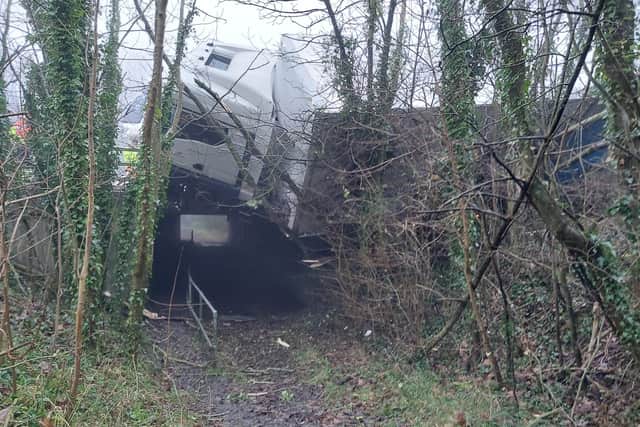 A road closure is in place until the vehicle is removed safely