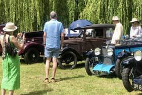 Vintage cars displayed around the gardens and lakes of Adwell House