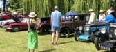 Vintage cars displayed around the gardens and lakes of Adwell House