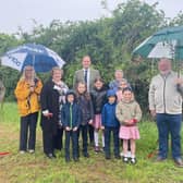 From left: Cllr Howard Mordue, Cllr Caroline Cornell, resident Zoe Buckle, MP Greg Smith, Mayor of Buckingham Margaret Gateley and Cllr Patrick Fealey with pupils from Lace Hill Academy.