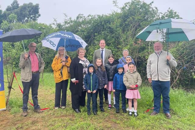 From left: Cllr Howard Mordue, Cllr Caroline Cornell, resident Zoe Buckle, MP Greg Smith, Mayor of Buckingham Margaret Gateley and Cllr Patrick Fealey with pupils from Lace Hill Academy.