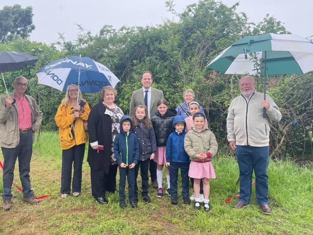 From left: Cllr Howard Mordue, Cllr Caroline Cornell, resident Zoe Buckle, MP Greg Smith, Mayor of Buckingham Margaret Gateley and Cllr Patrick Fealey with pupils from Lace Hill Academy.